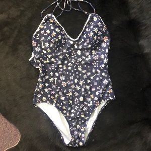 Floral one piece with ruffle and back detail